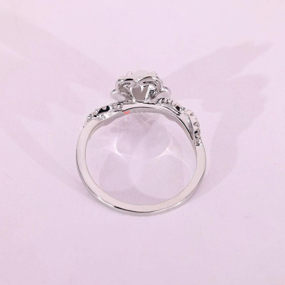 Unique round diamond engagement ring in white gold.
