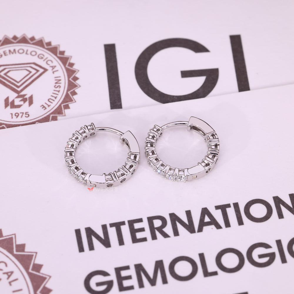 Round diamond earrings with clean white gold finish.