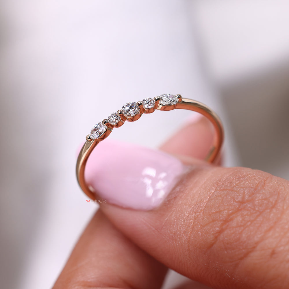 Diamond set east to west in yellow gold wedding band.