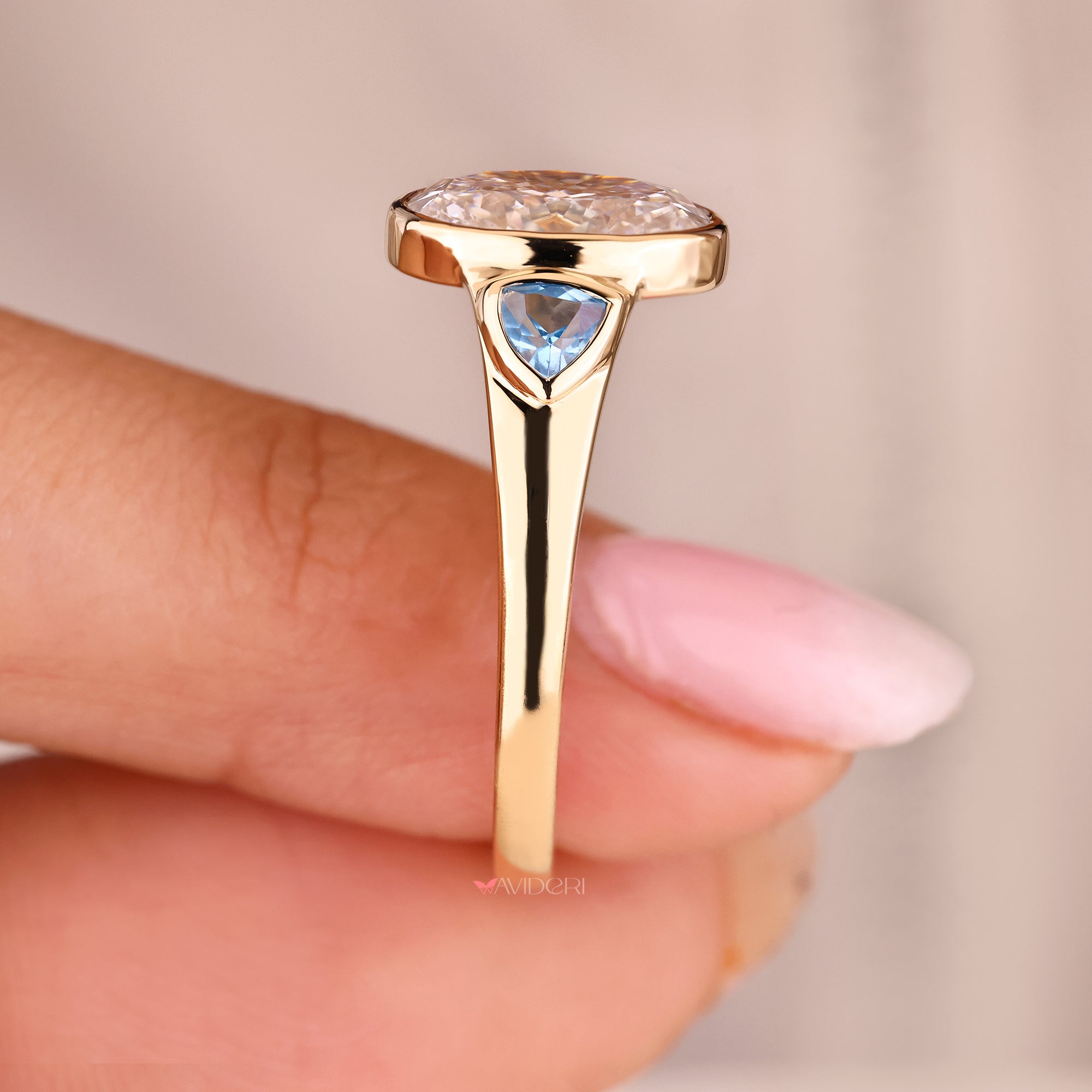 Trillion diamond ring with side stone accents.
