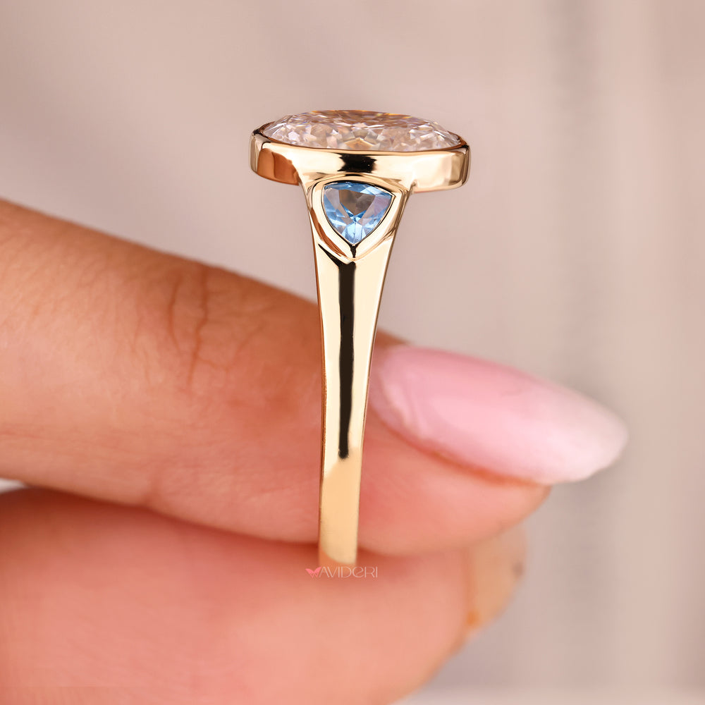 Trillion diamond ring with side stone accents.