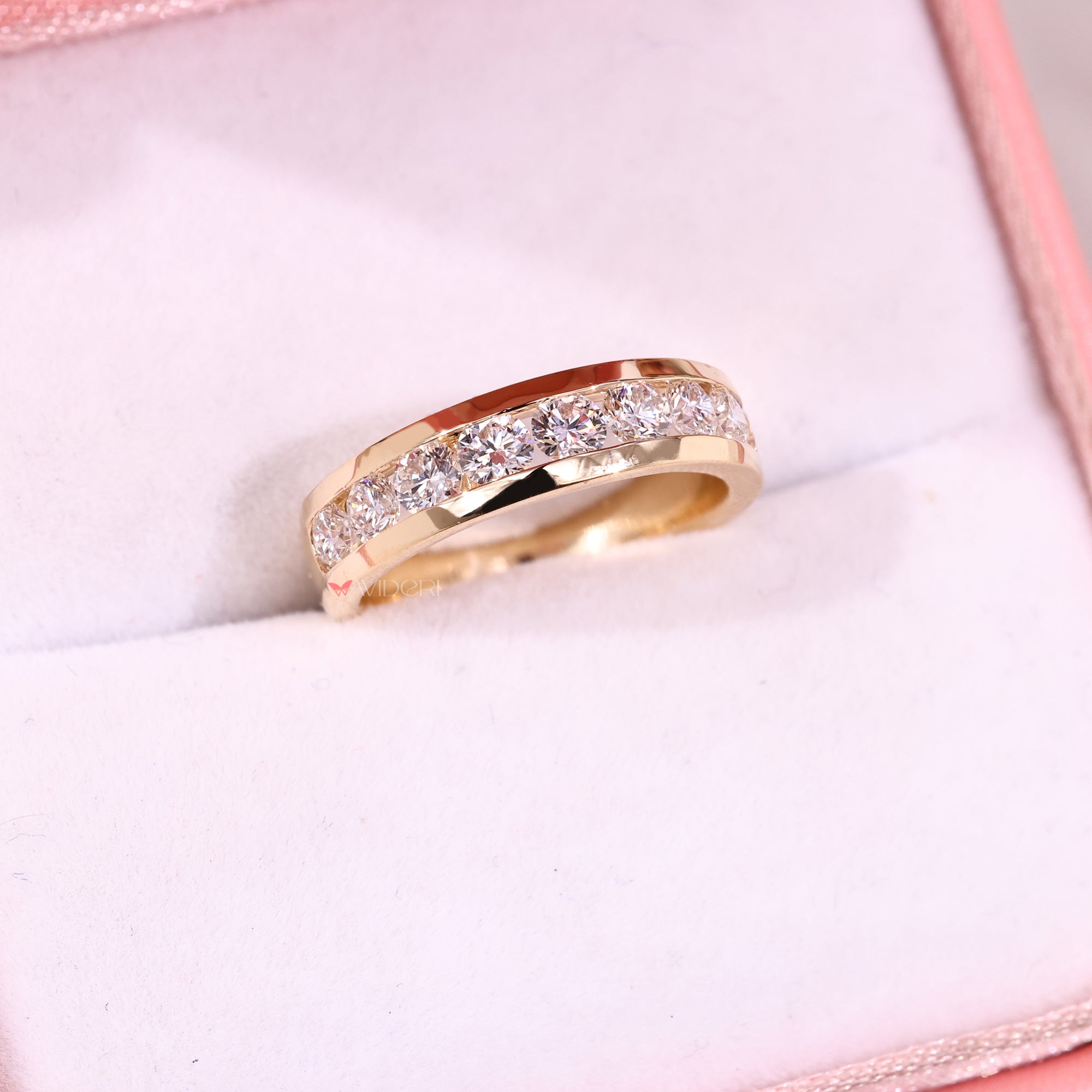 Avideri wedding band with gold design and diamond row.