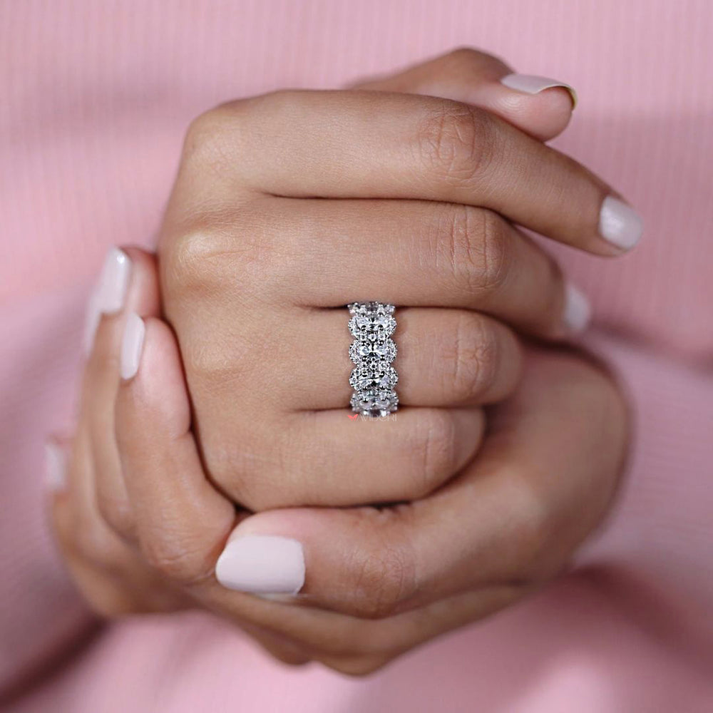 Oval wedding band with halo style round moissanite.