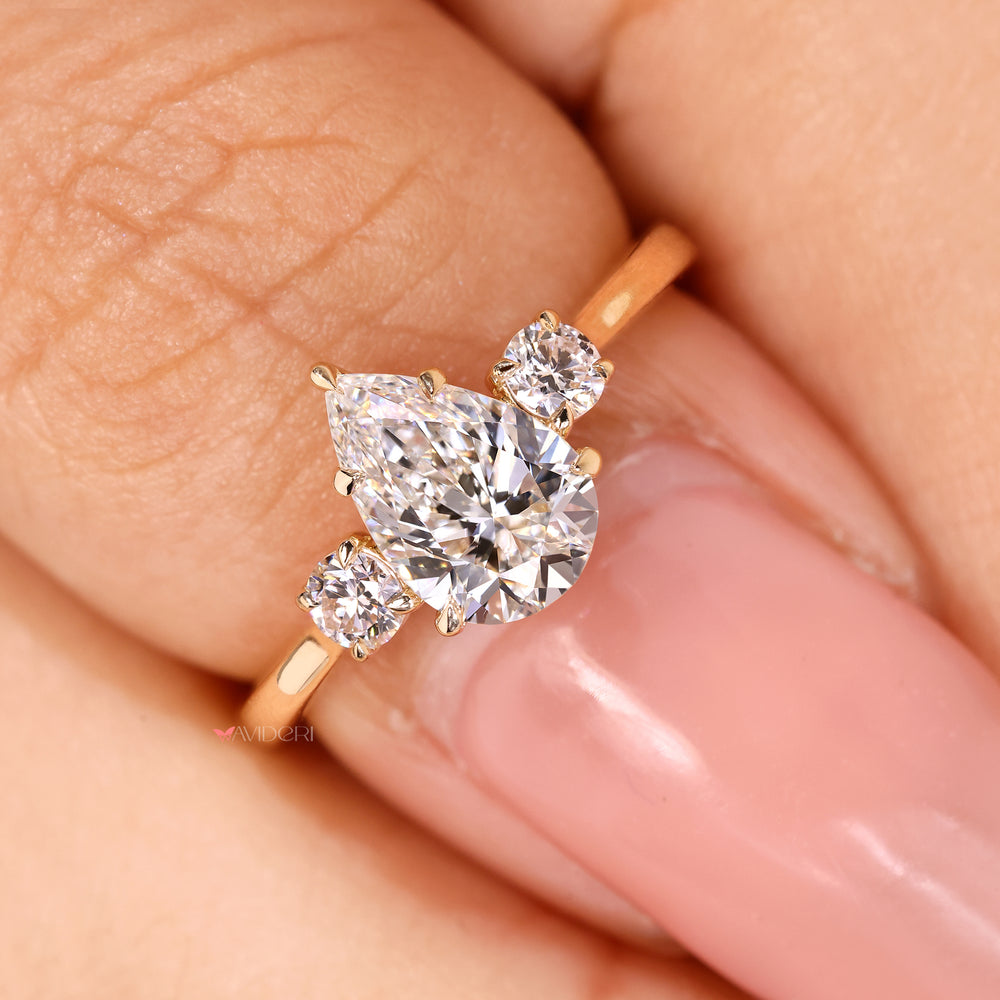 IGI certified pear engagement ring with round side diamonds
