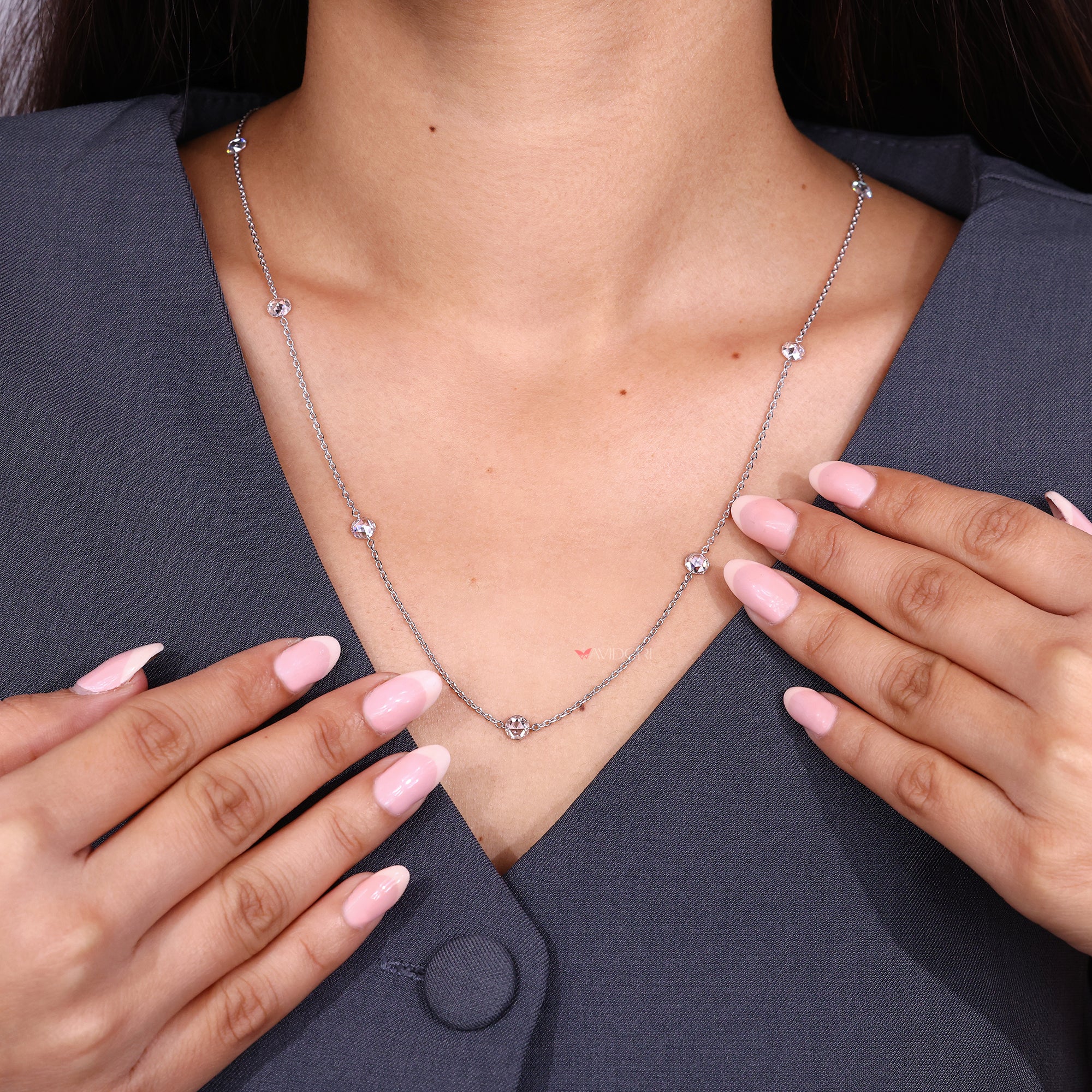 Chain diamond necklace with round stones.
