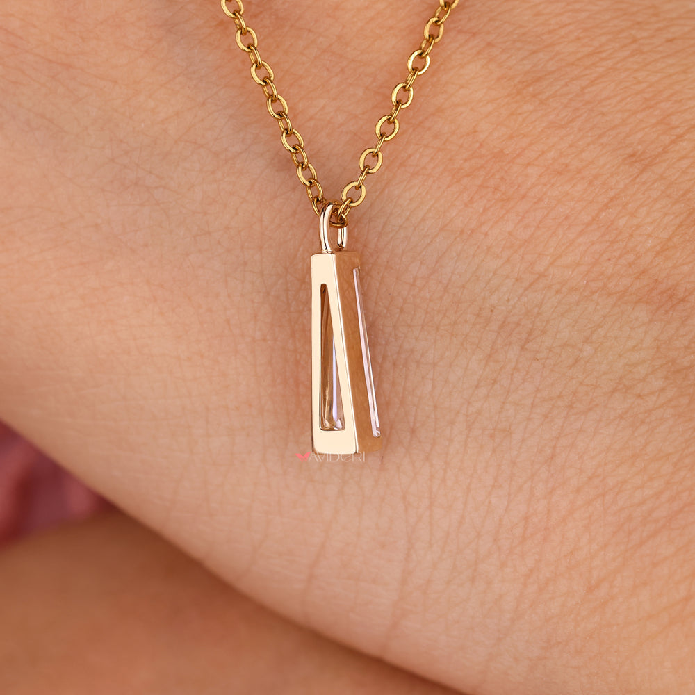 Avideri moissanite pendant with tapered baguette cut accents.
