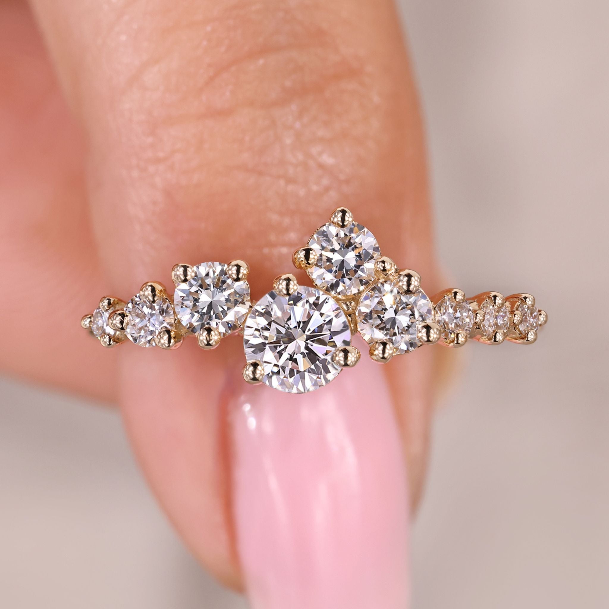 Round diamond engagement ring with cluster setting.
