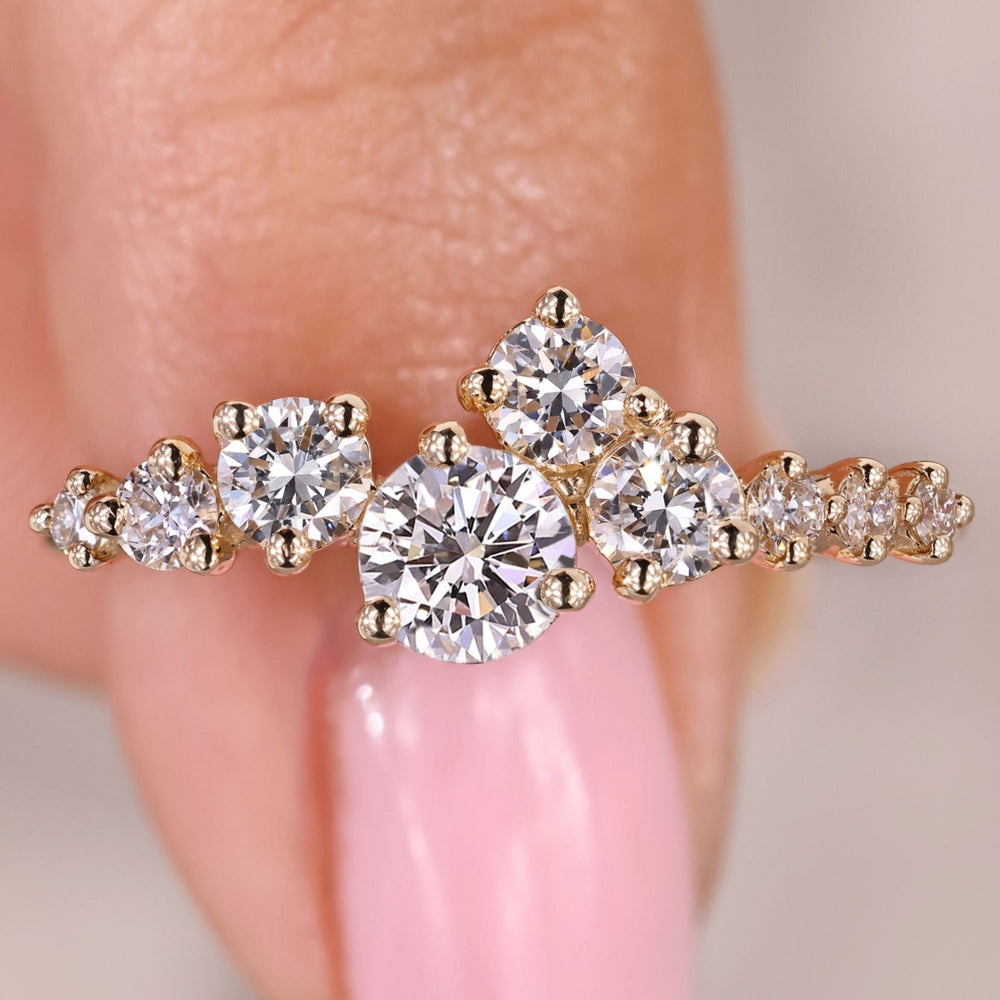 Round diamond engagement ring with cluster setting.