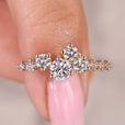 Round diamond engagement ring with cluster setting.