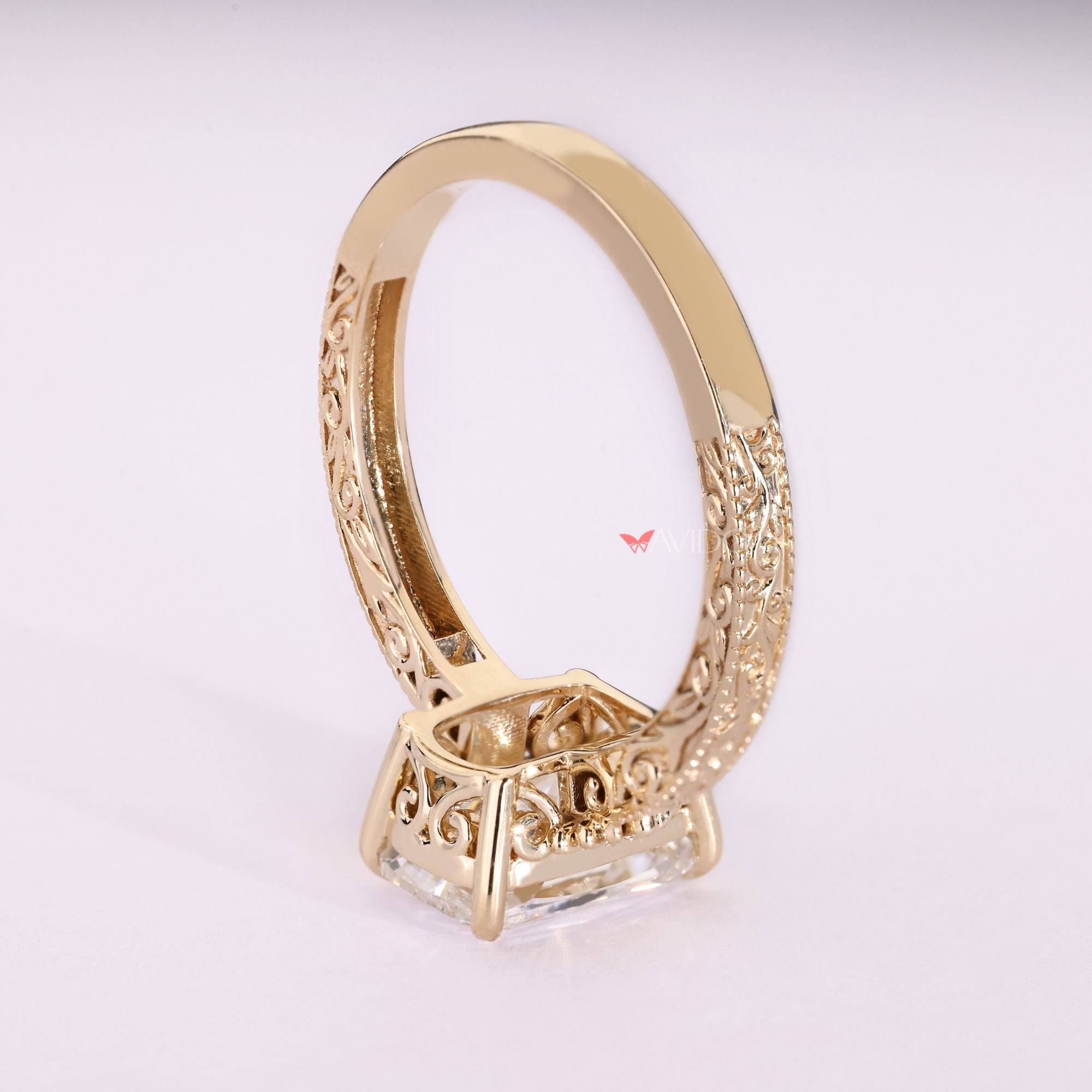 Lab grown cushion diamond ring with scrollwork.
