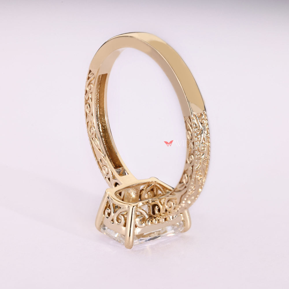 Lab grown cushion diamond ring with scrollwork.

