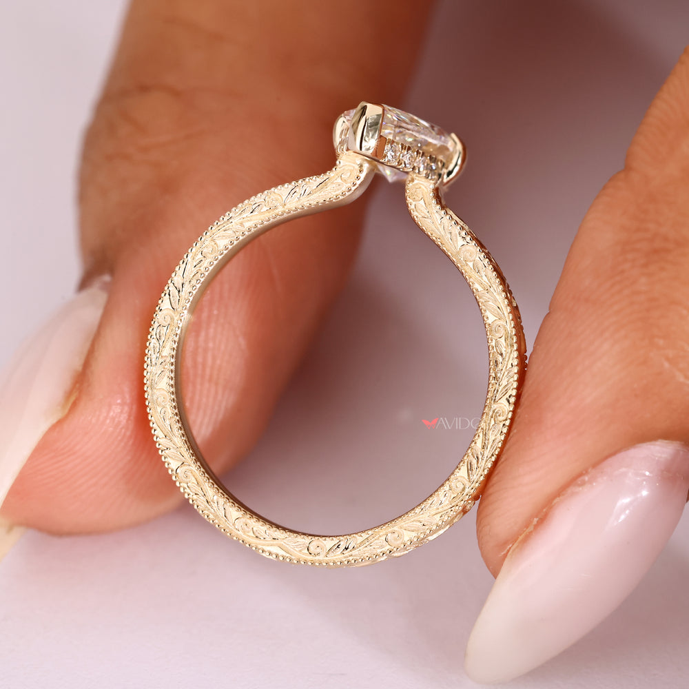Hidden halo marquise diamond ring with open gallery.
