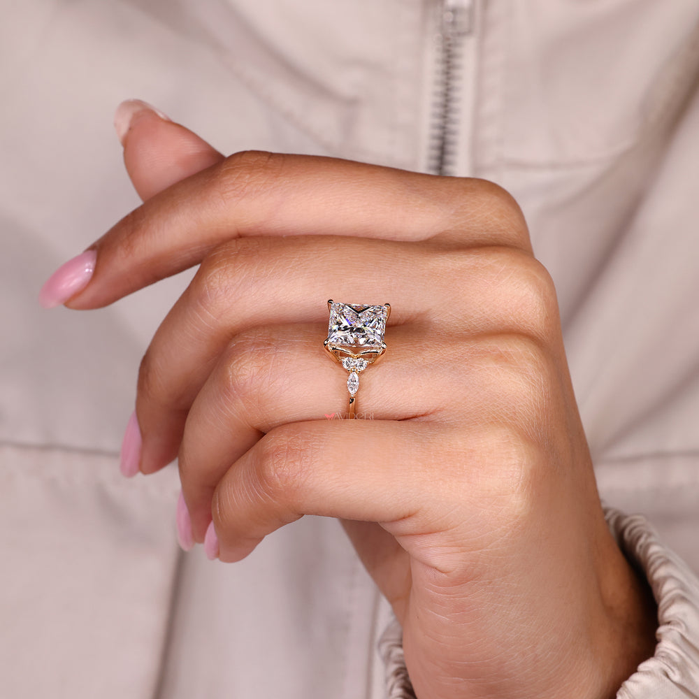 Handmade princess cut diamond ring with four claw prongs.