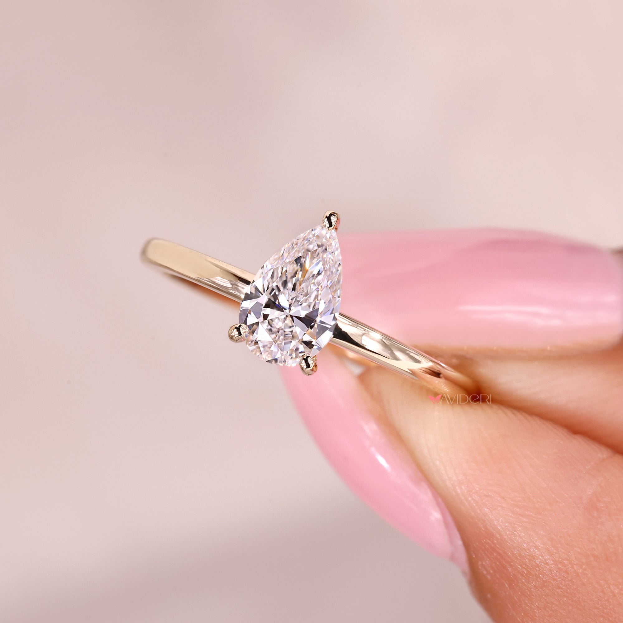 Pear cut diamond ring with clean simple design.
