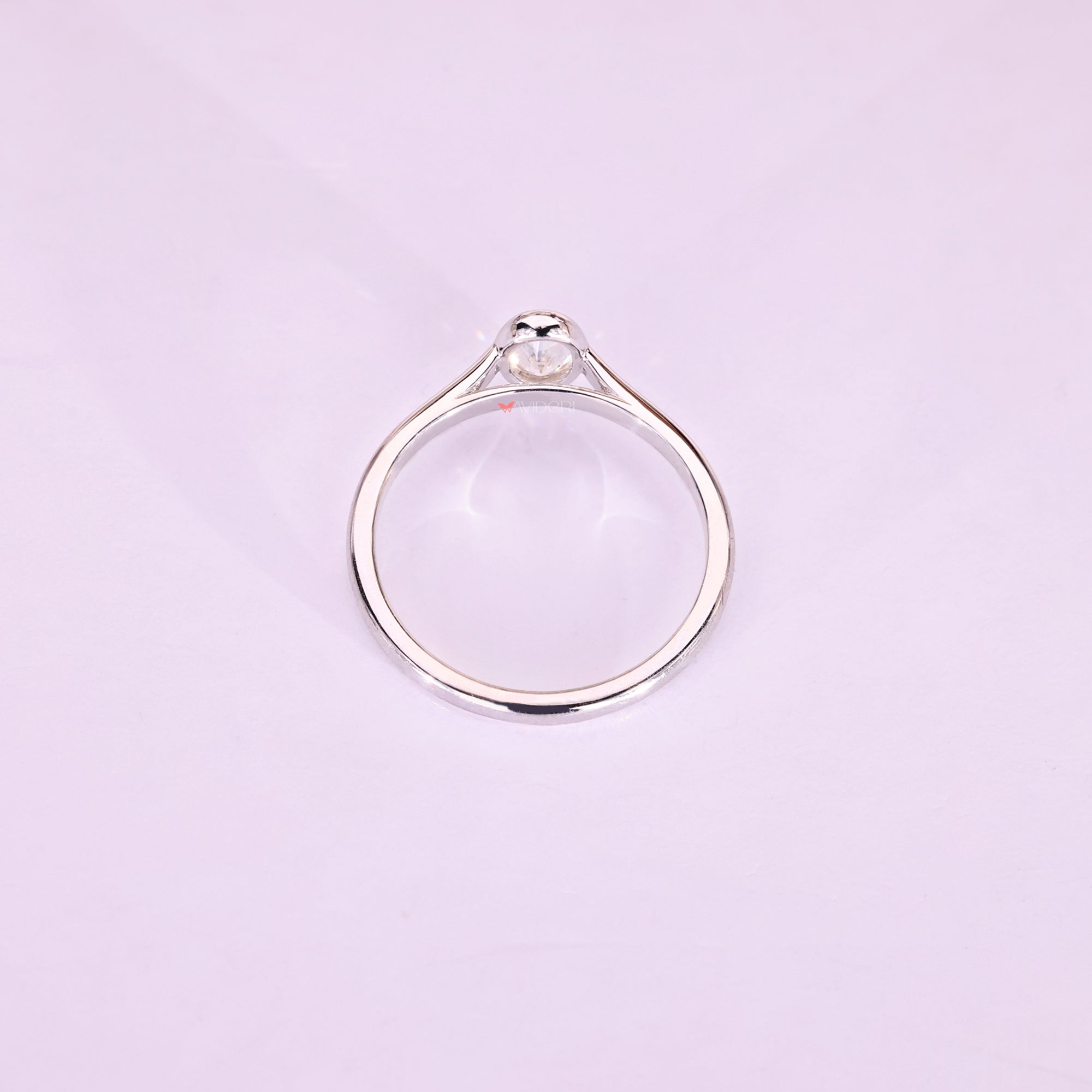 This white gold ring gleams with warm, radiant charm.