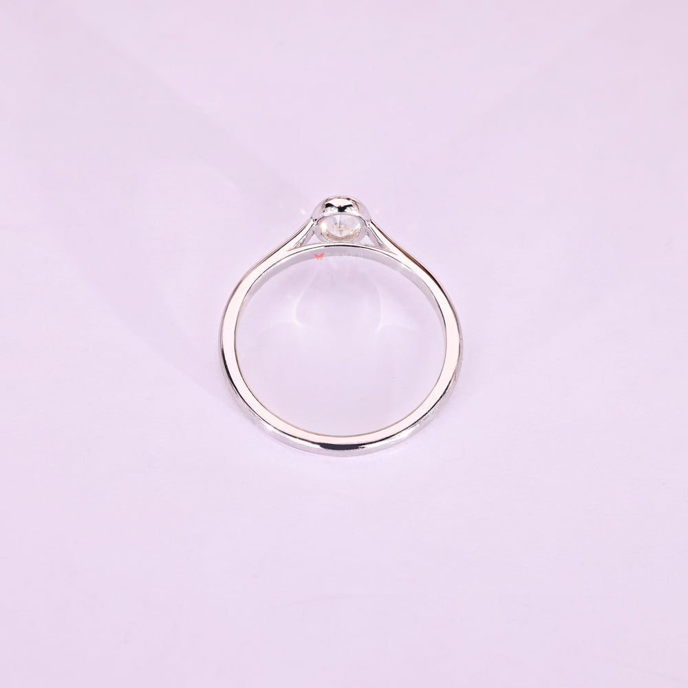 This white gold ring gleams with warm, radiant charm.