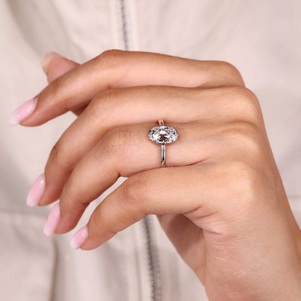 Solitaire ring with oval old European cut and claw prongs.