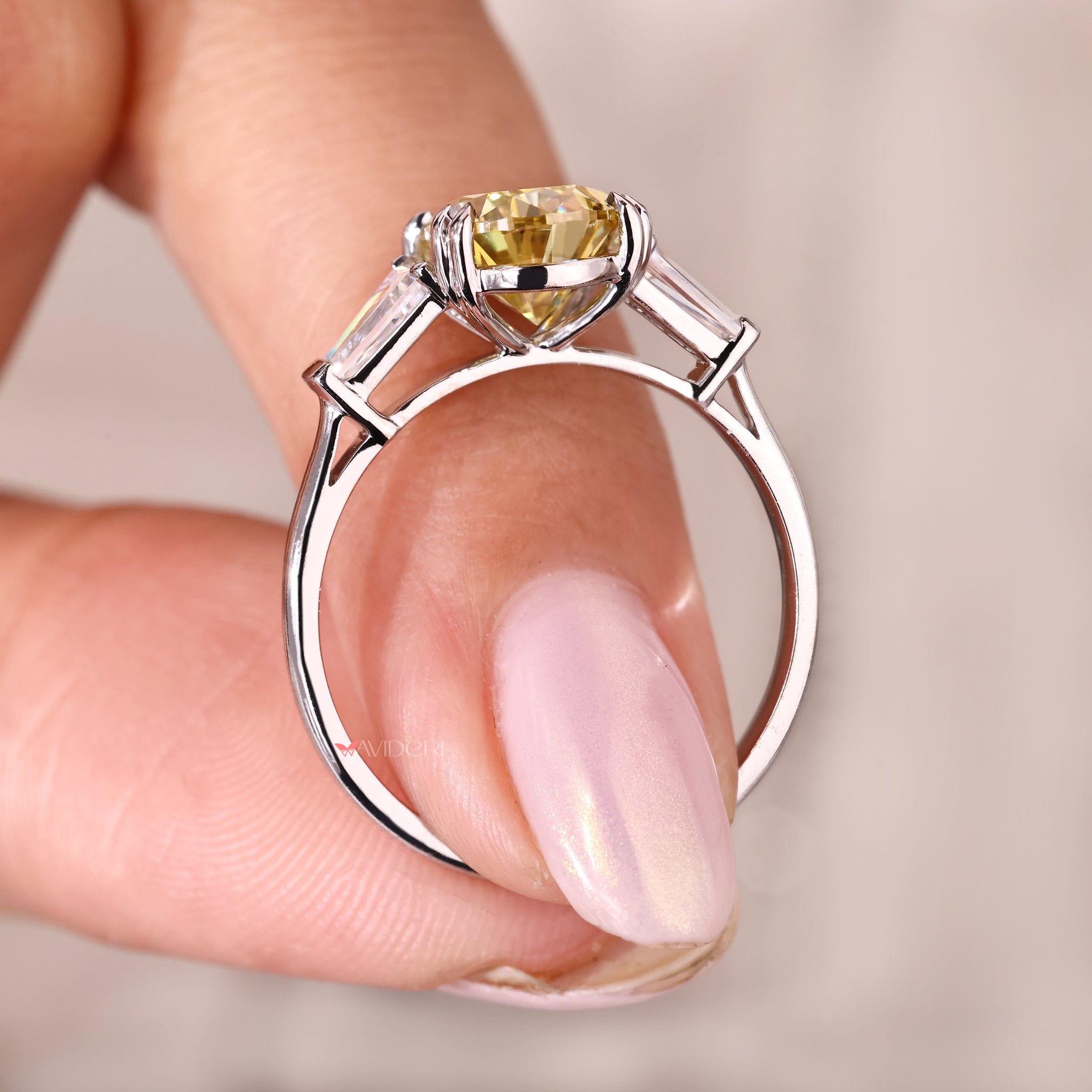 Pear cut engagement ring designed in white gold with a classic cathedral setting.
