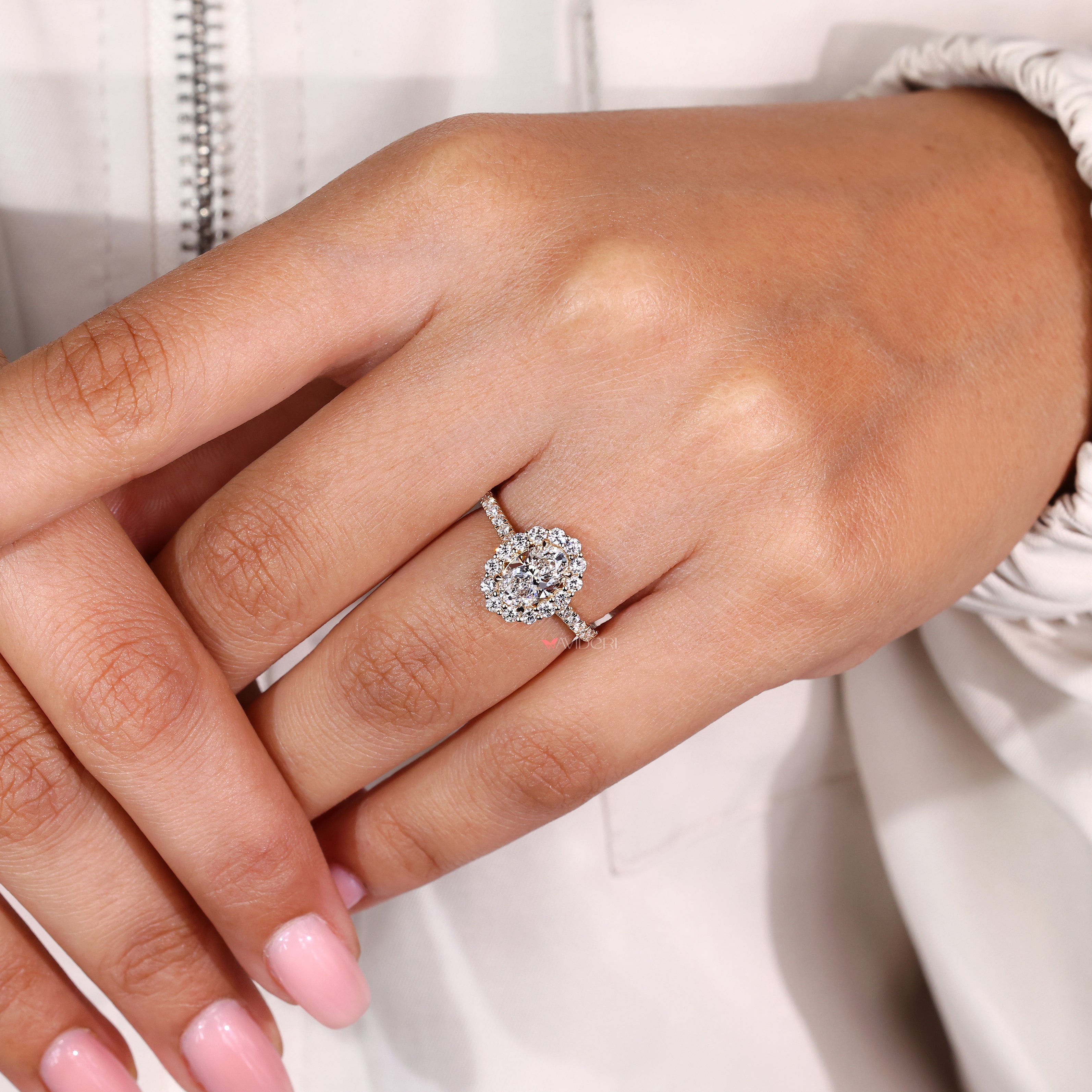 IGI certified oval engagement ring with round diamond accents
