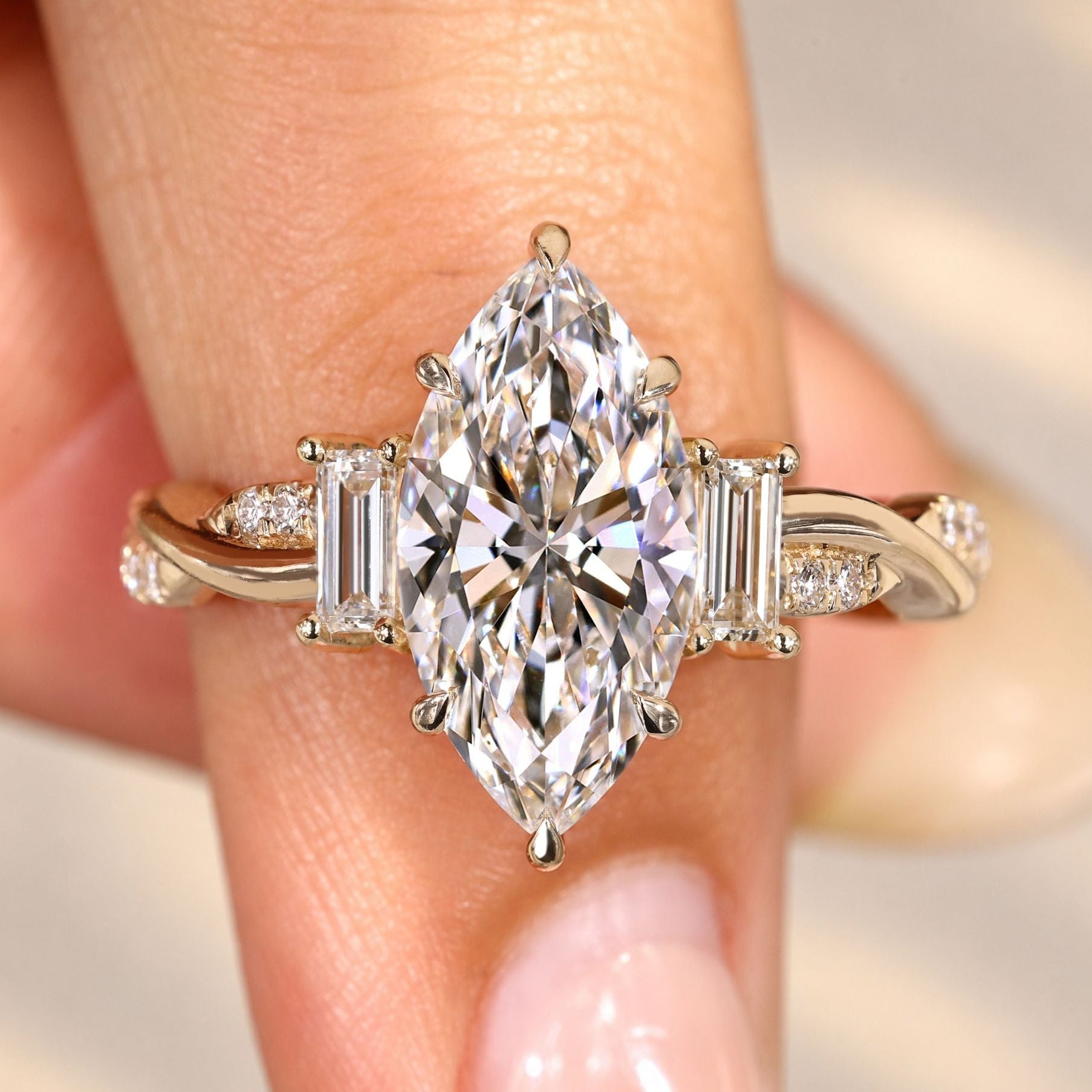 Marquise diamond ring with baguette side stones.
