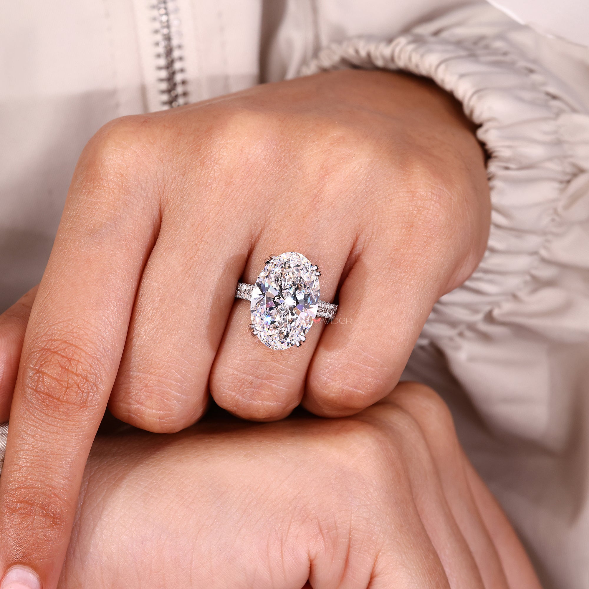 Handmade oval diamond ring with double claw prong setting.