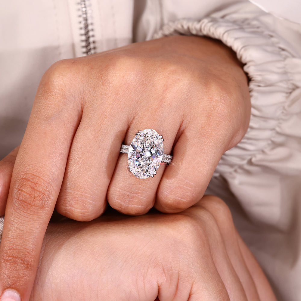 Handmade oval diamond ring with double claw prong setting.