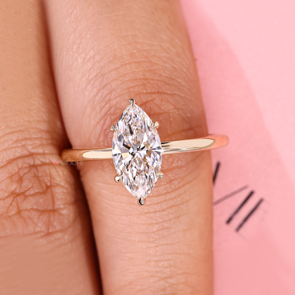 Handmade marquise cut diamond ring in six prong setting.
