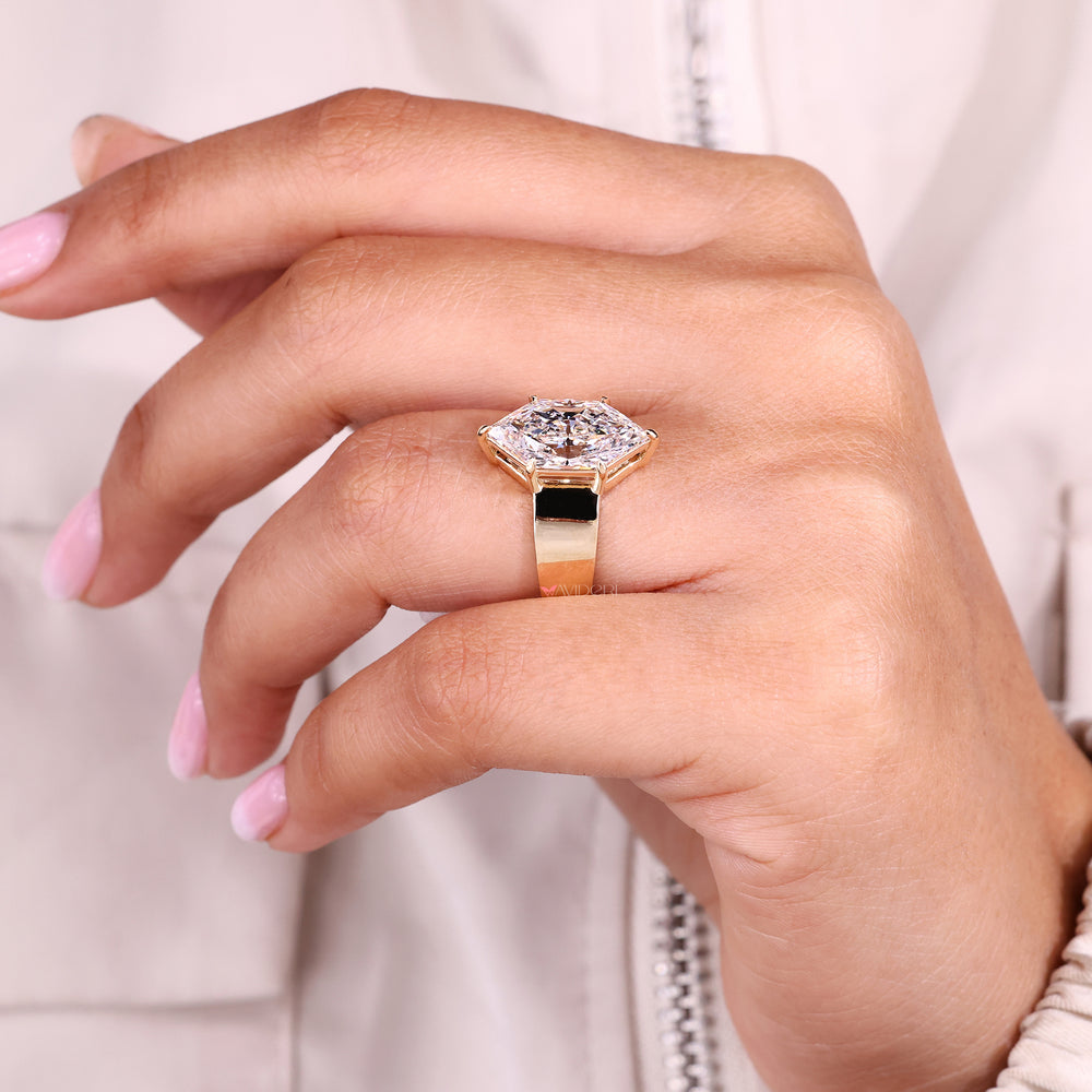 Custom diamond ring with marquise cut stone.