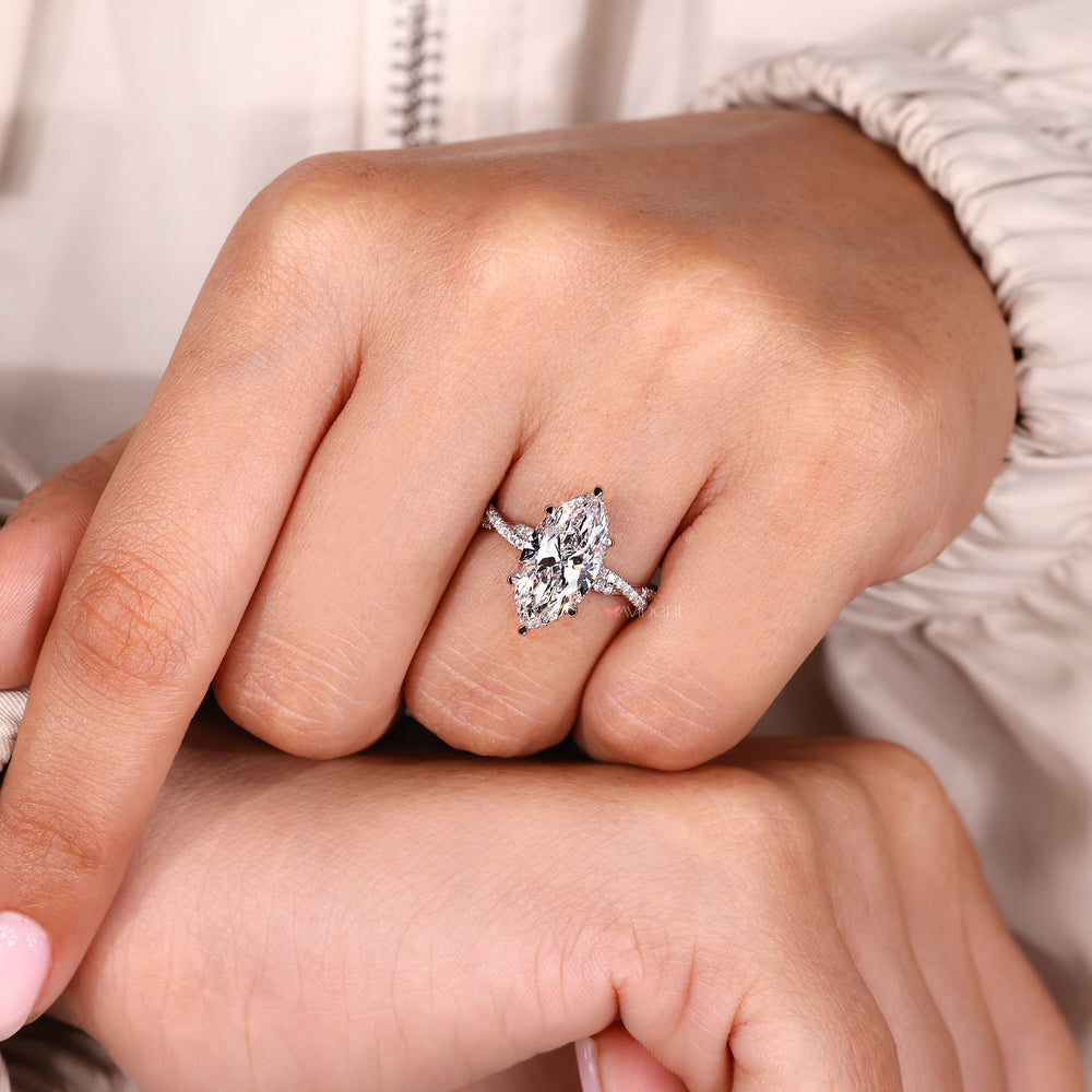 Hidden halo engagement ring with white gold diamond ring.
