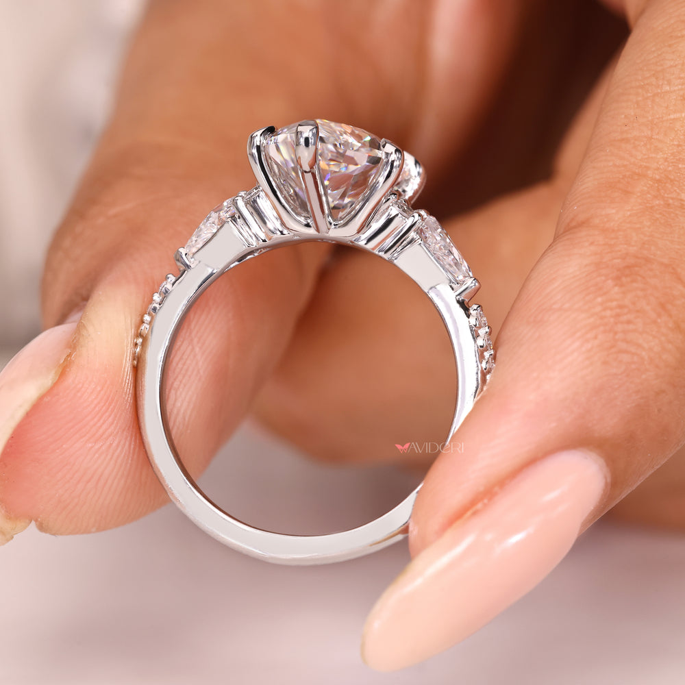Handmade marquise diamond ring with muse setting and accents
