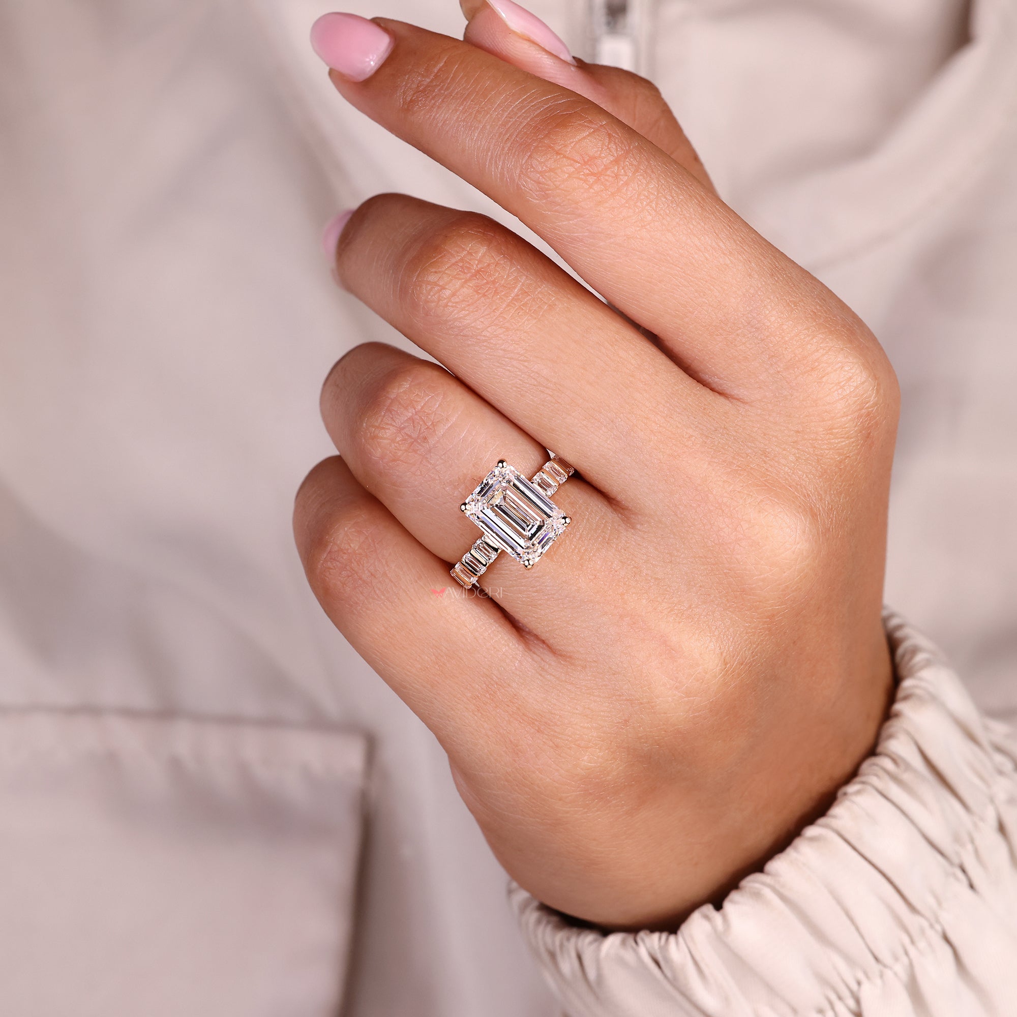 Handmade emerald cut diamond ring with pave band.
