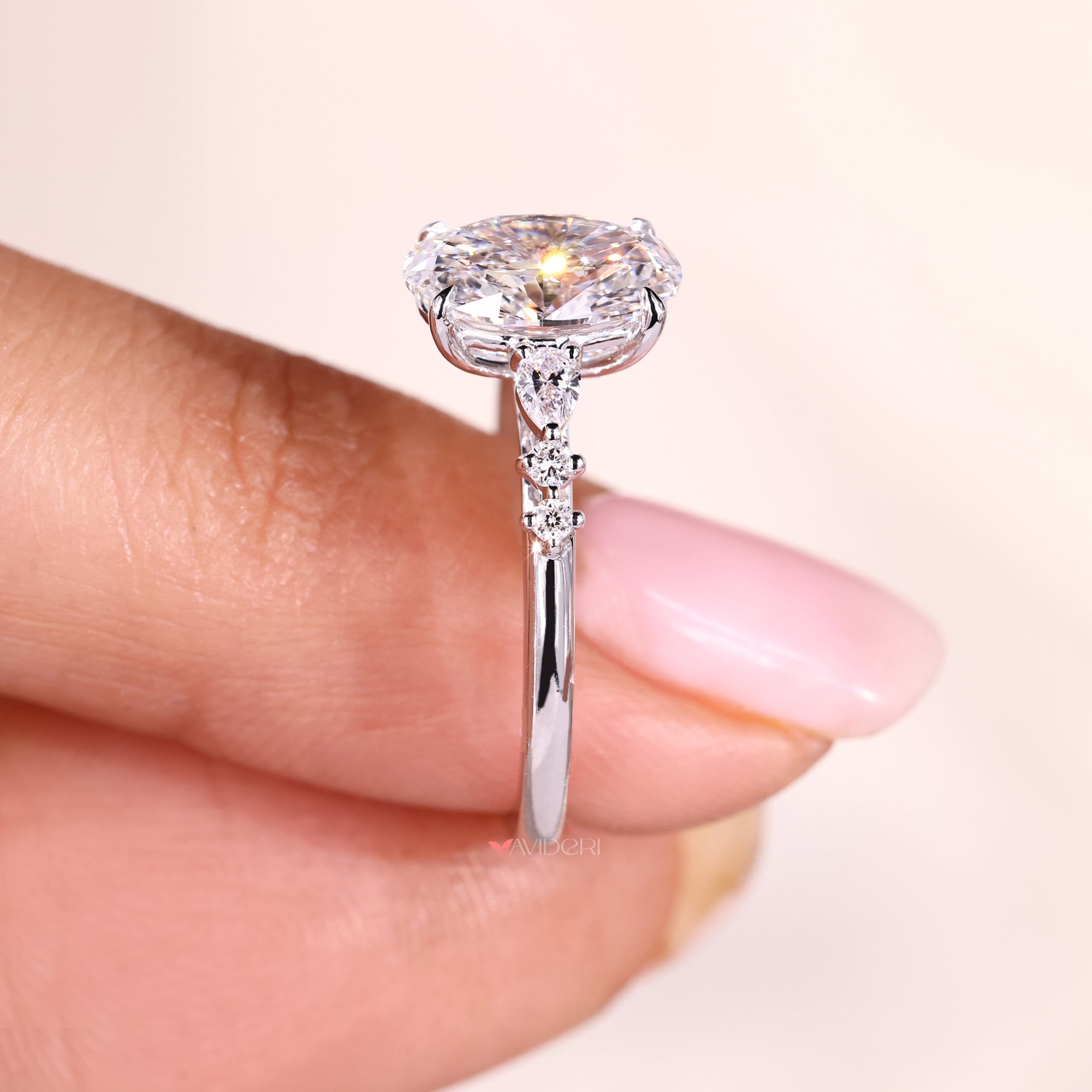 Seven Stone Diamond Ring with Oval Cut Center.