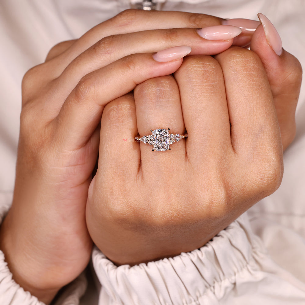 Cushion lab diamond ring with muse setting and prongs.
