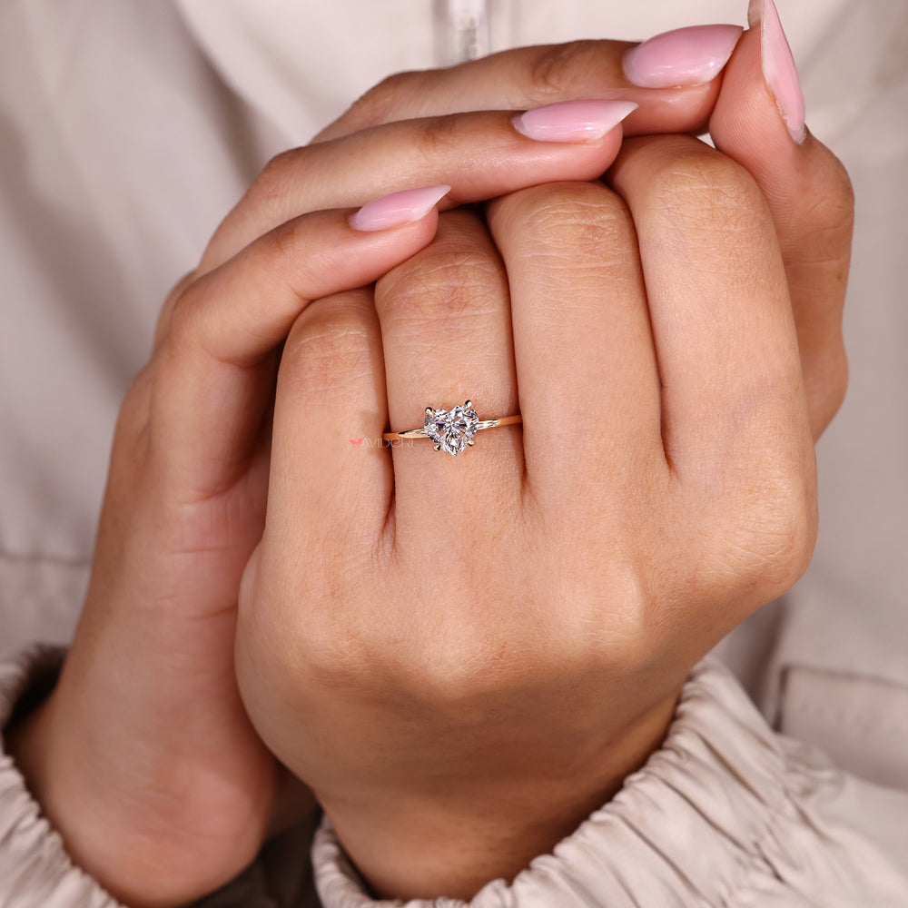 Heart cut diamond ring with soft hidden halo brilliance.
