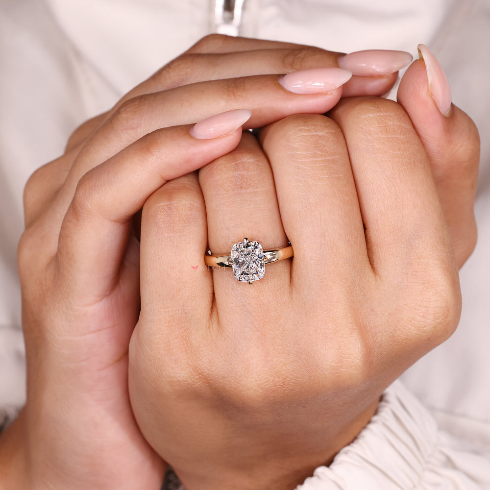 Cushion diamond ring with basket and prongs.
