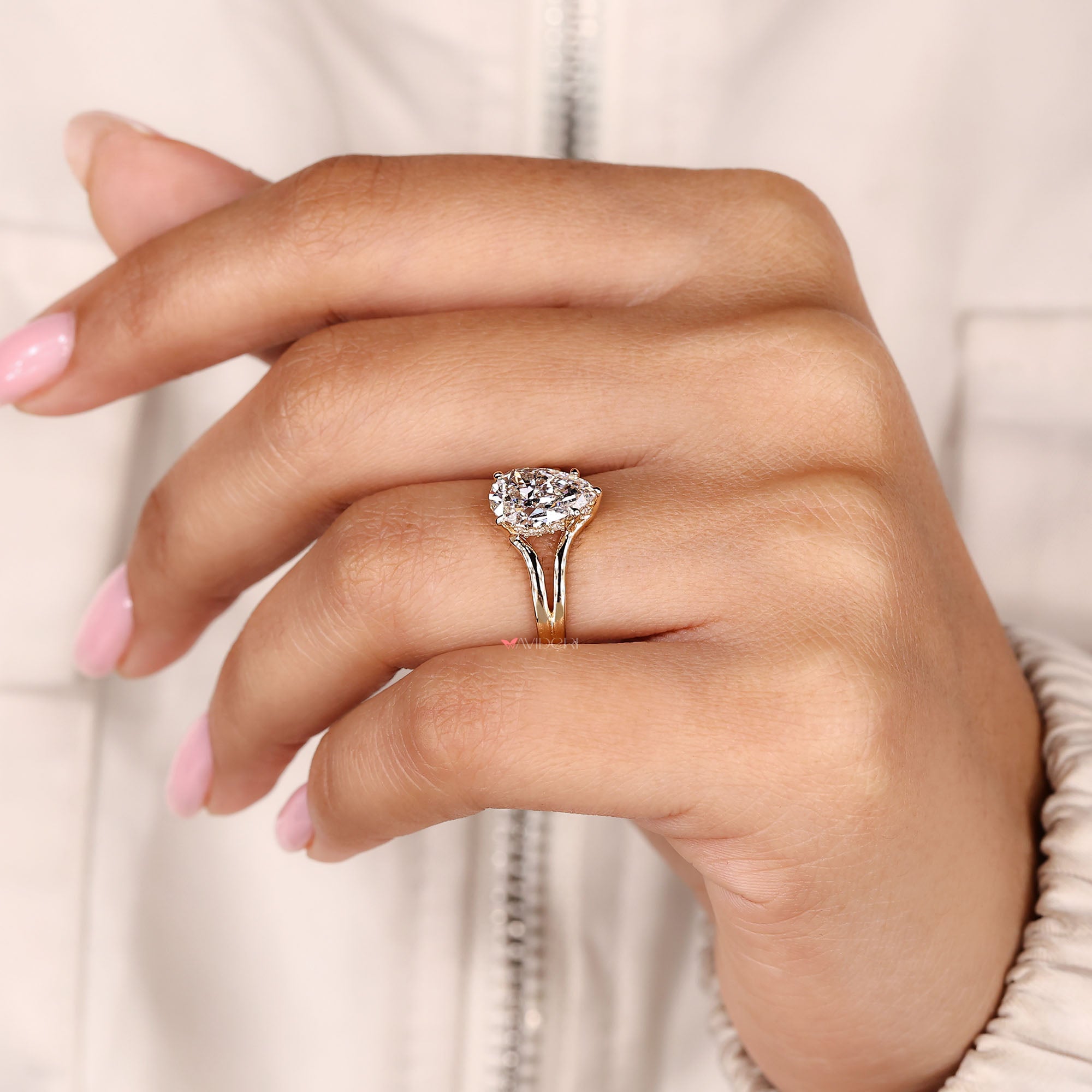 IGI certified pear cut diamond ring with solitaire hidden halo style