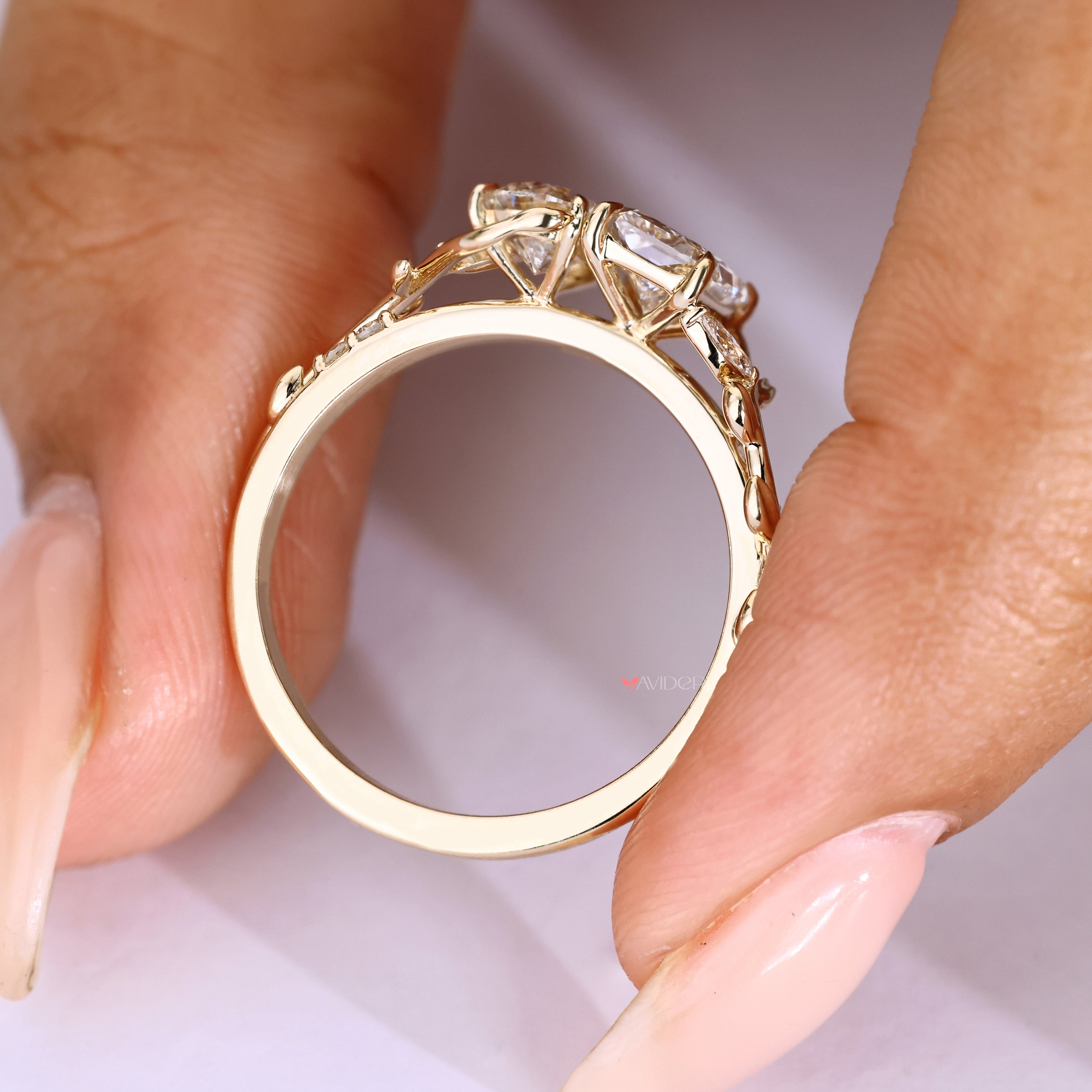 Pear radiant diamond ring with marquise side stones.
