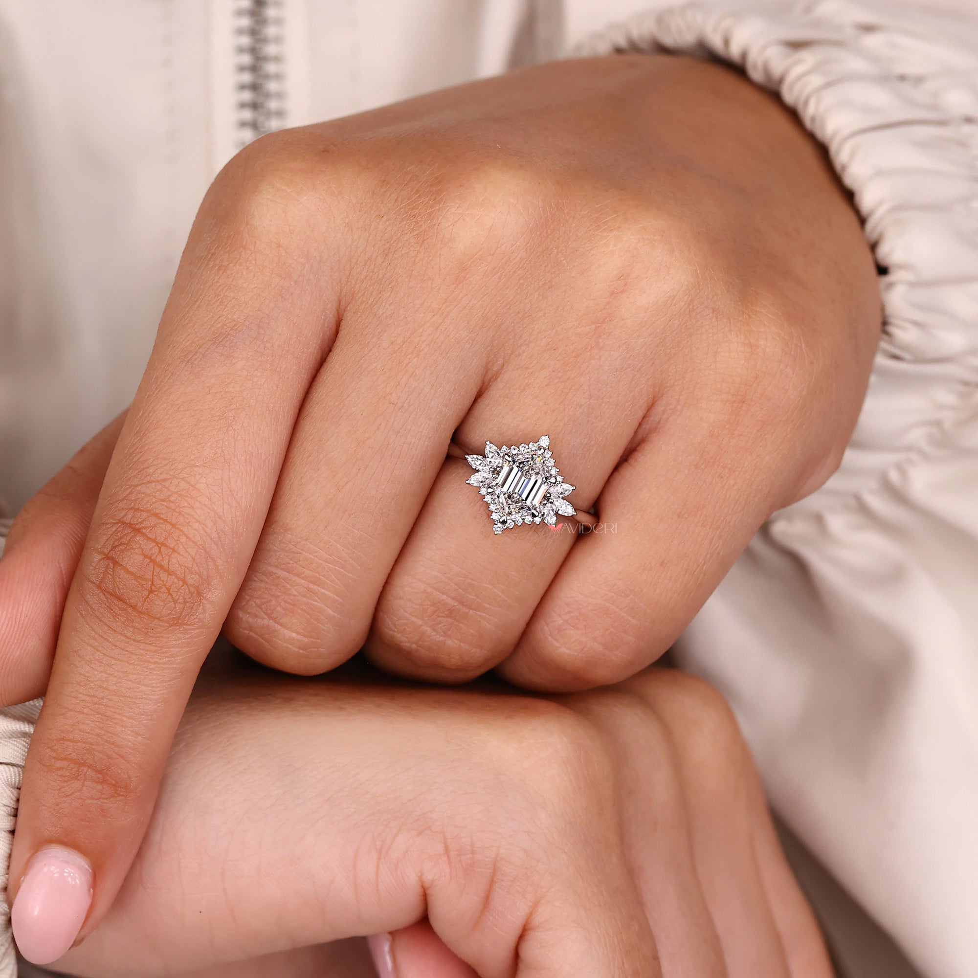 Marquise and round side stone with muse setting.