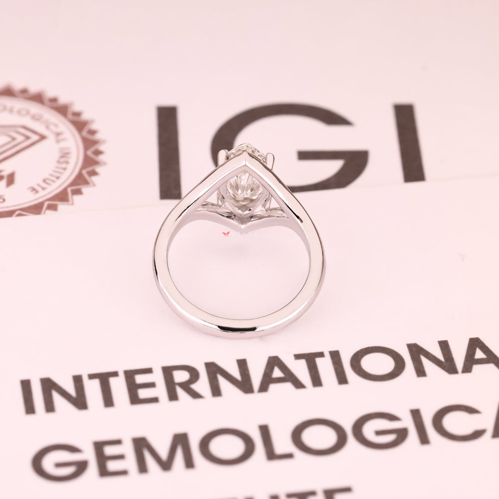 Marquise cut diamond ring with four claw prong setting
