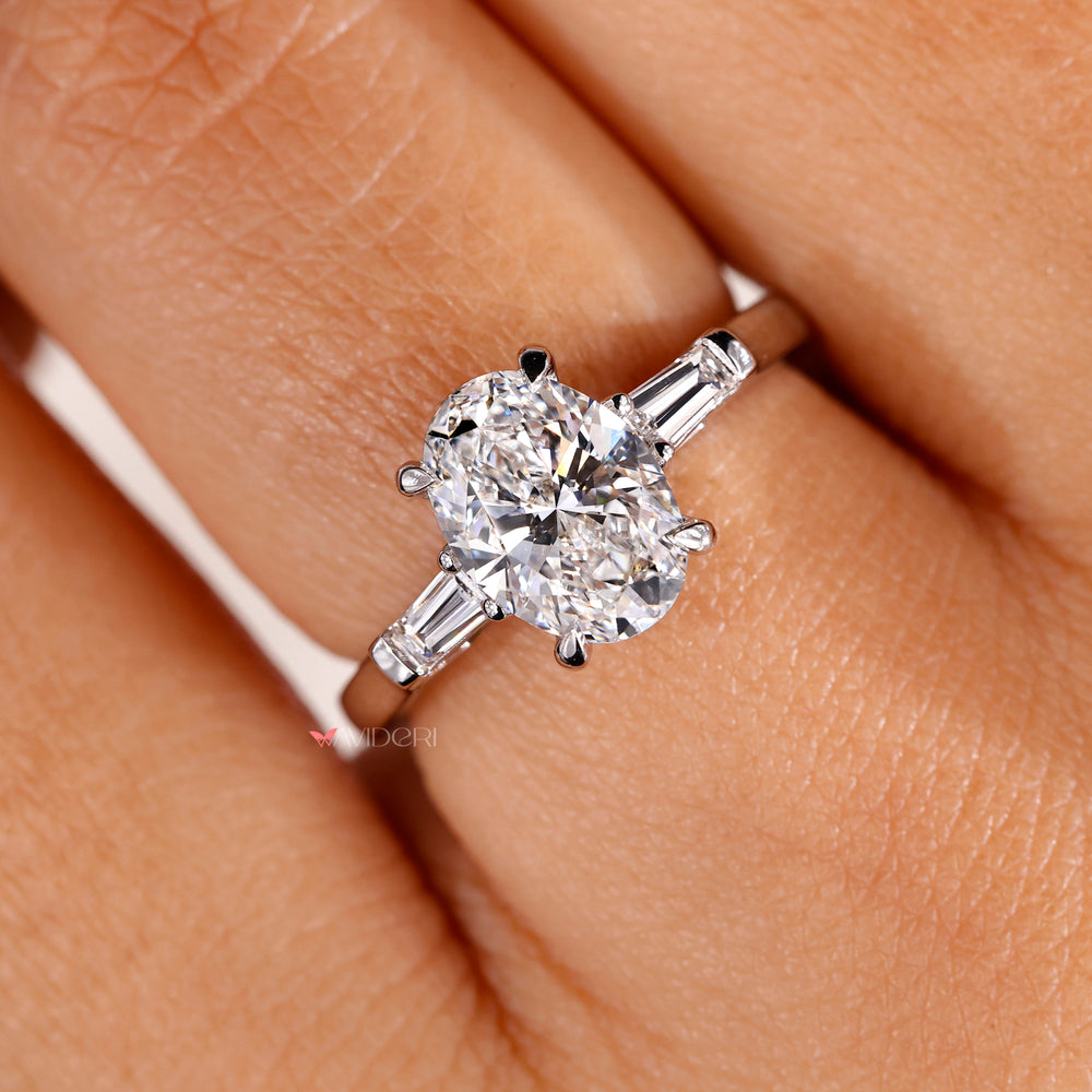 4 prong ring featuring an oval shaped diamond for a secure and radiant design.
