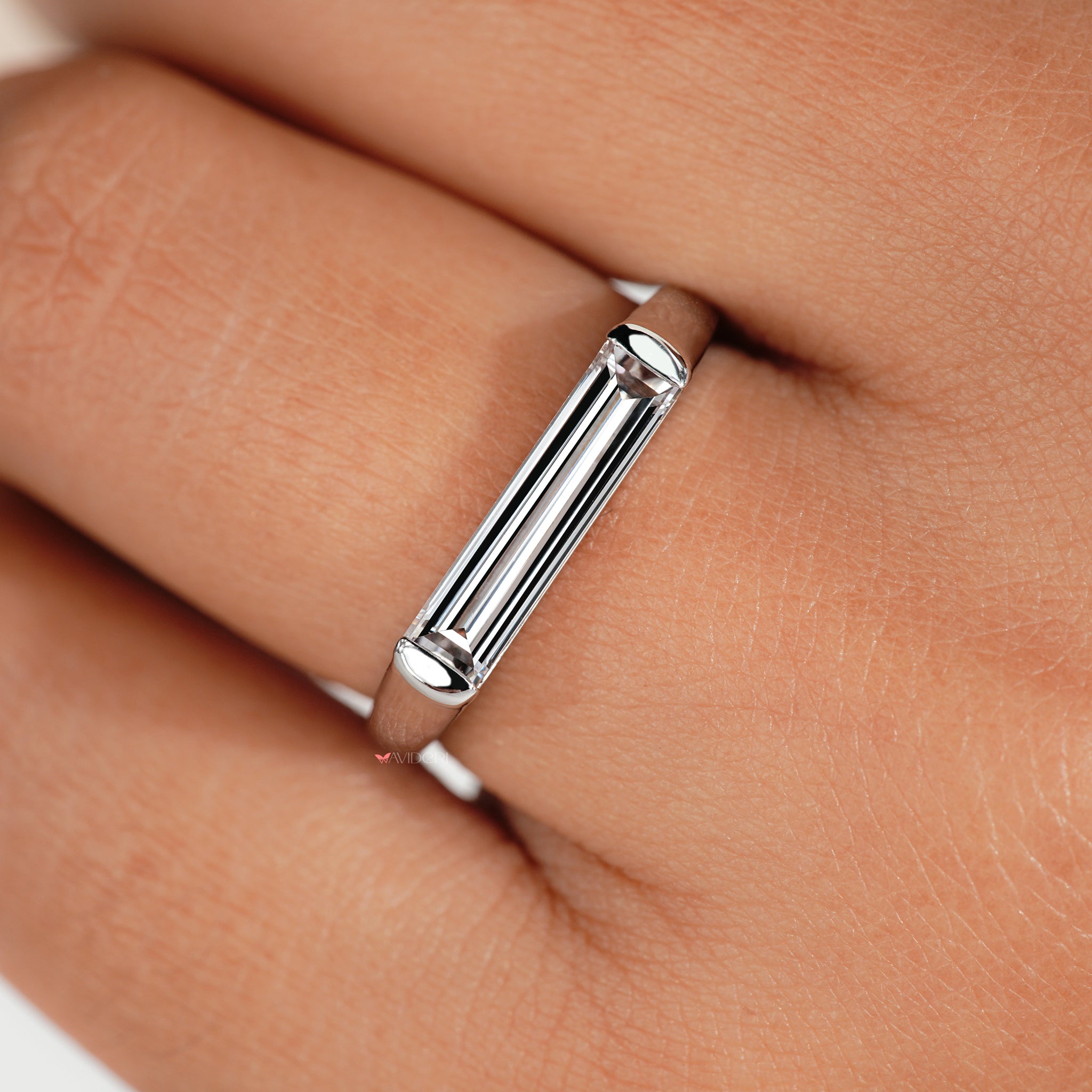 Sophisticated east west ring setting designed for a unique and modern style.