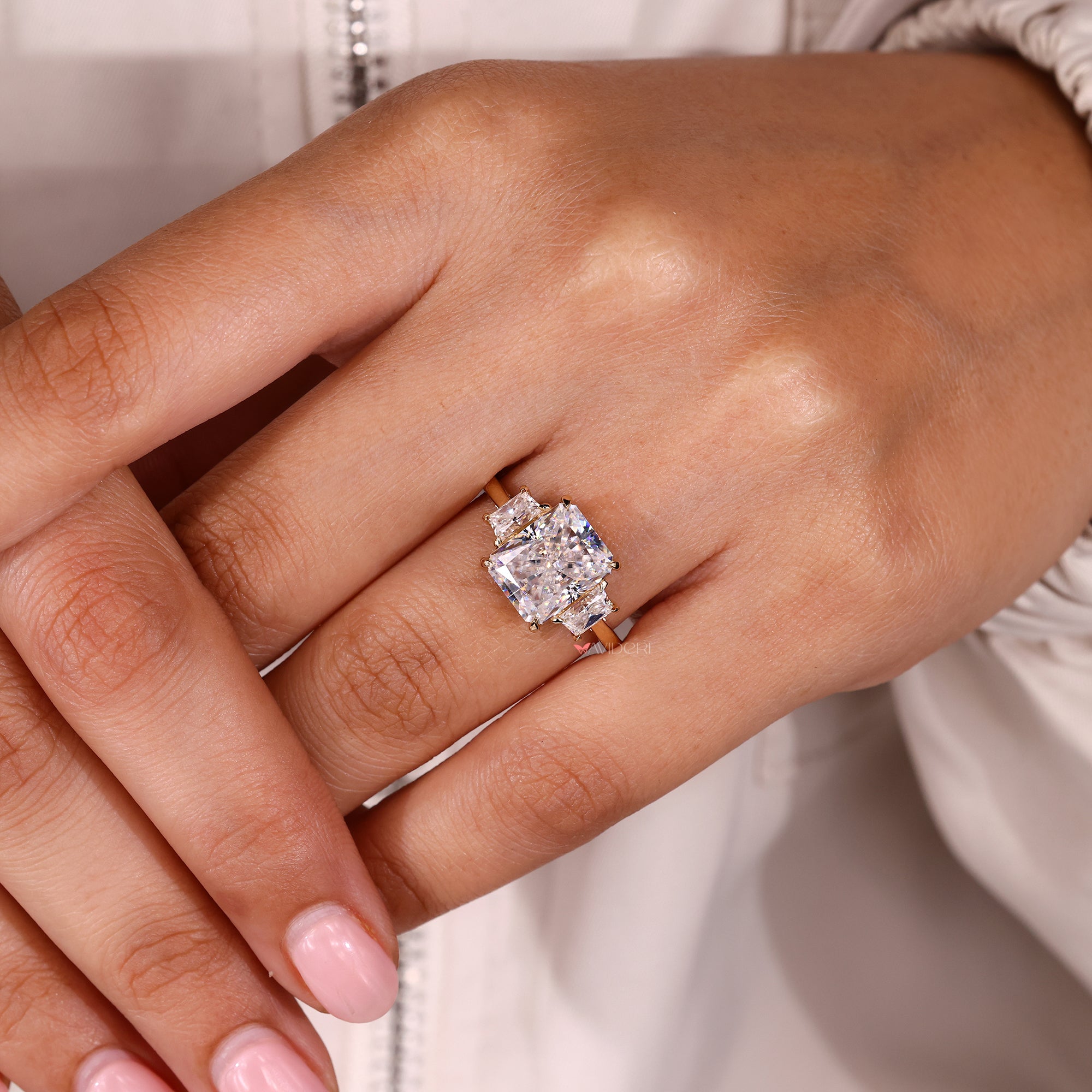 Custom moissanite ring with cathedral setting style.