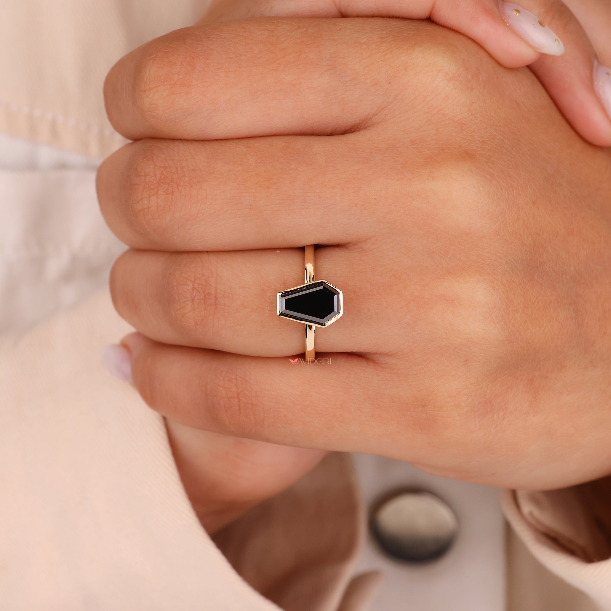Warm tones radiate from the yellow gold engagement ring.
