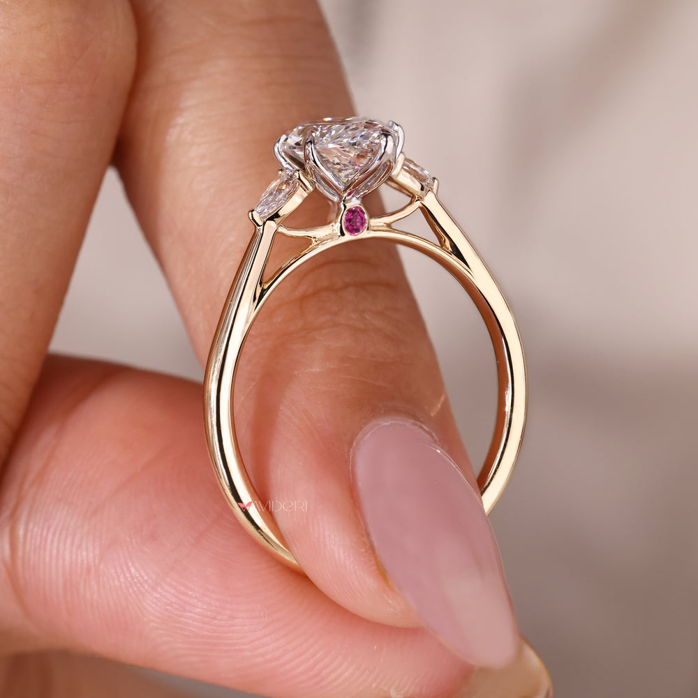 Dark ruby ring set in two-tone gold.