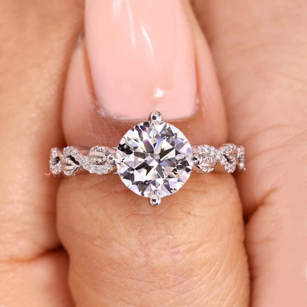 Cathedral setting round ring with pave style.
