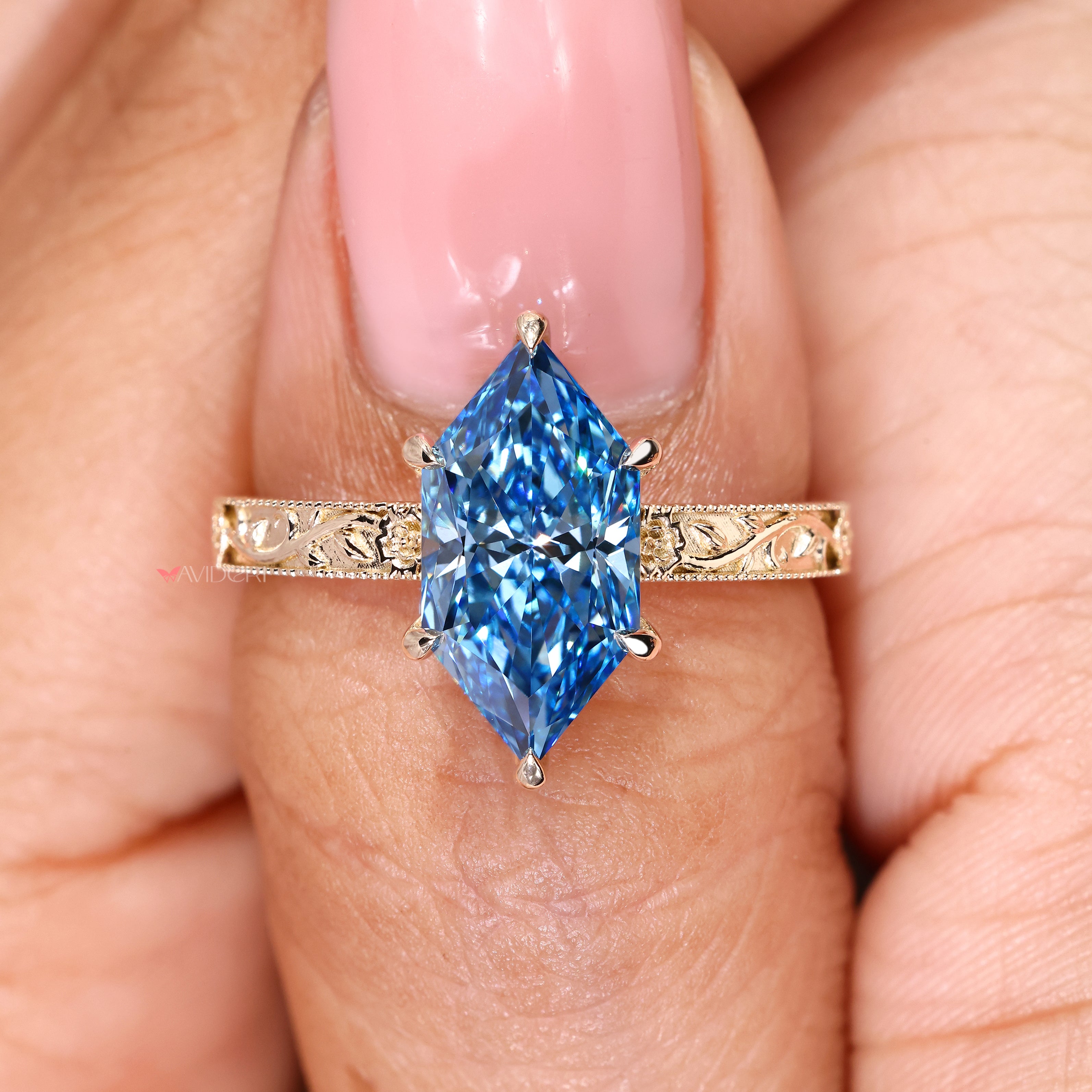 Handmade blue Dutch marquise diamond ring with milgrain details
