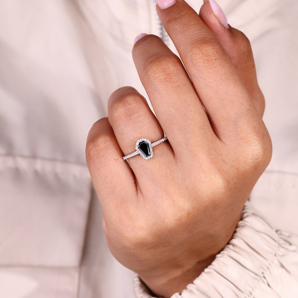 Four prong coffin cut engagement ring with halo.