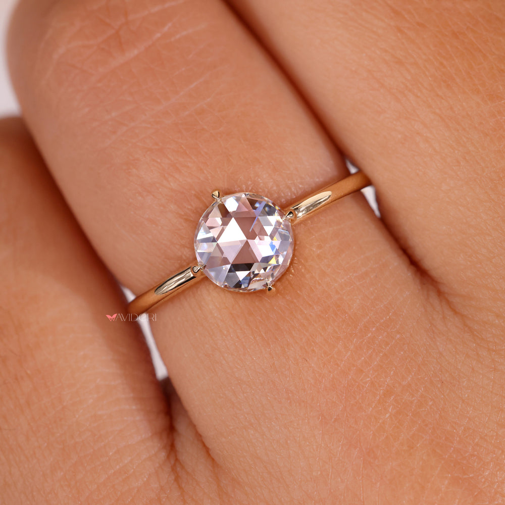 Solitaire setting ring with a round diamond for brilliance.
