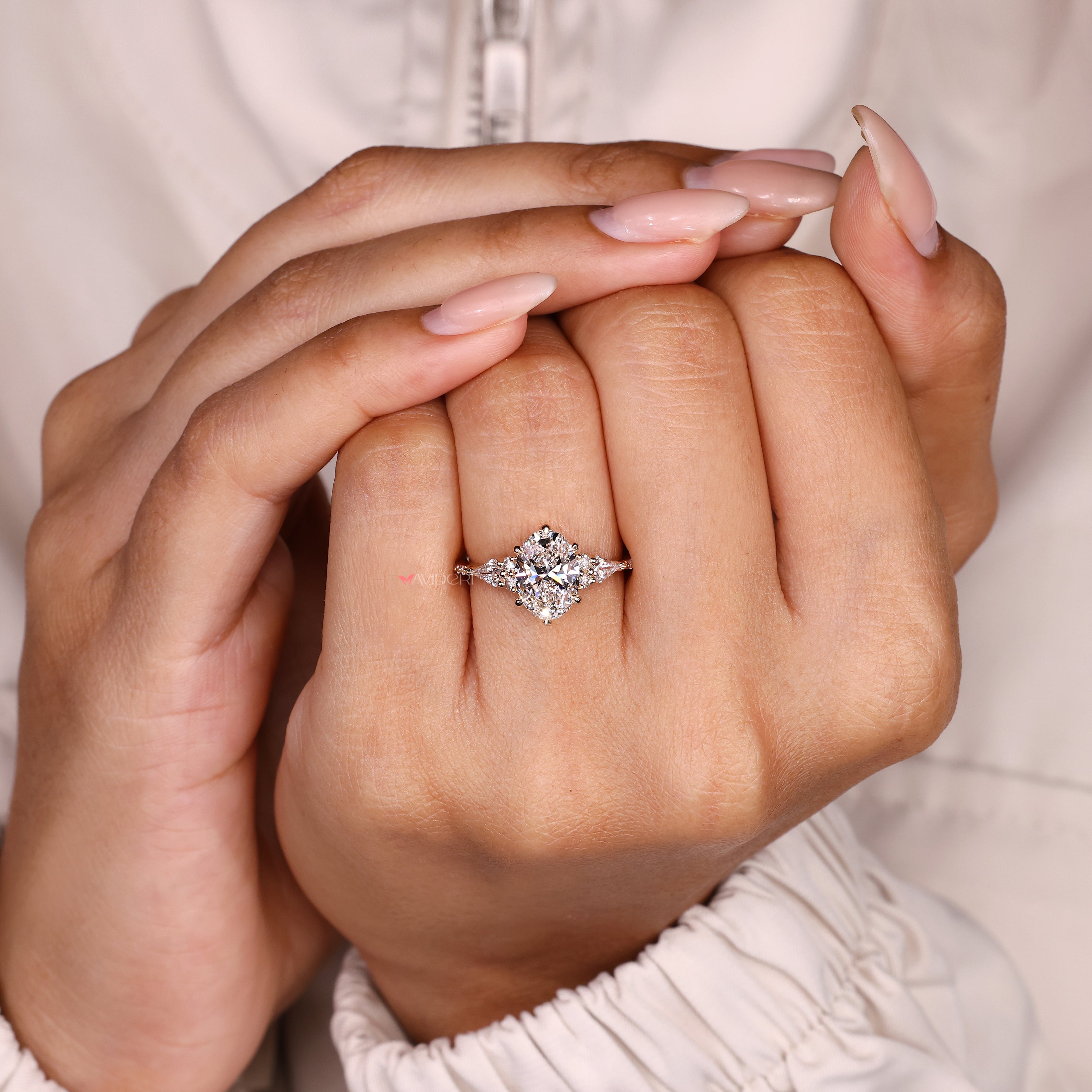 Oval diamond ring with muse setting and pave style
