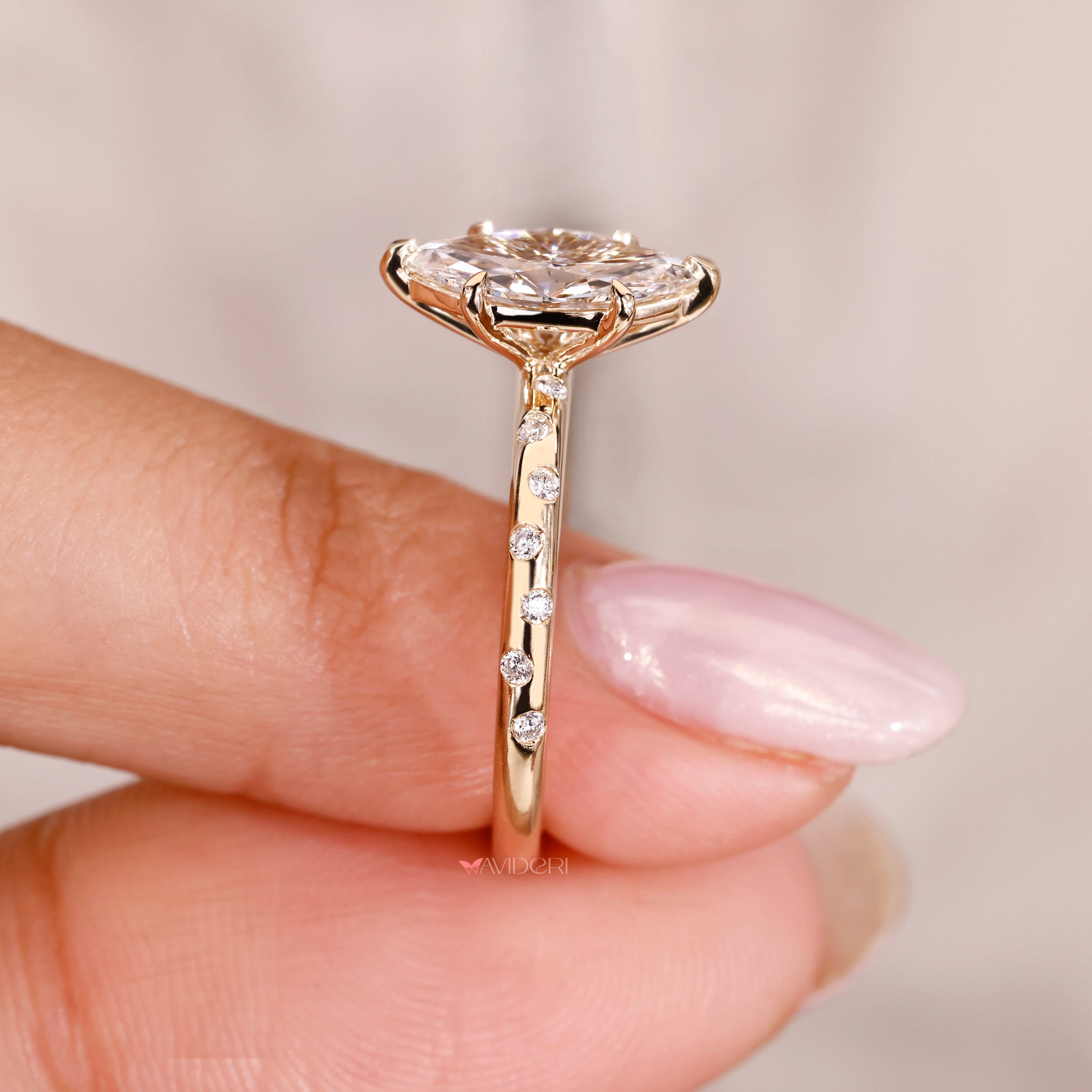 flush setting ring with round and marquise diamonds in handmade yellow gold band.